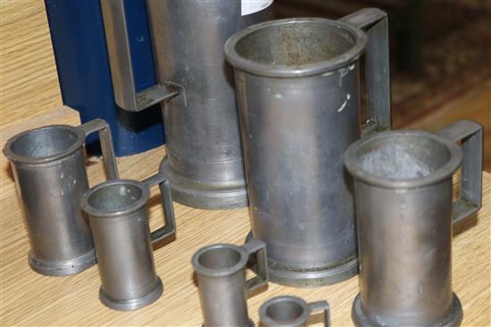 A set of seven French graduated pewter measures tallest 19cm